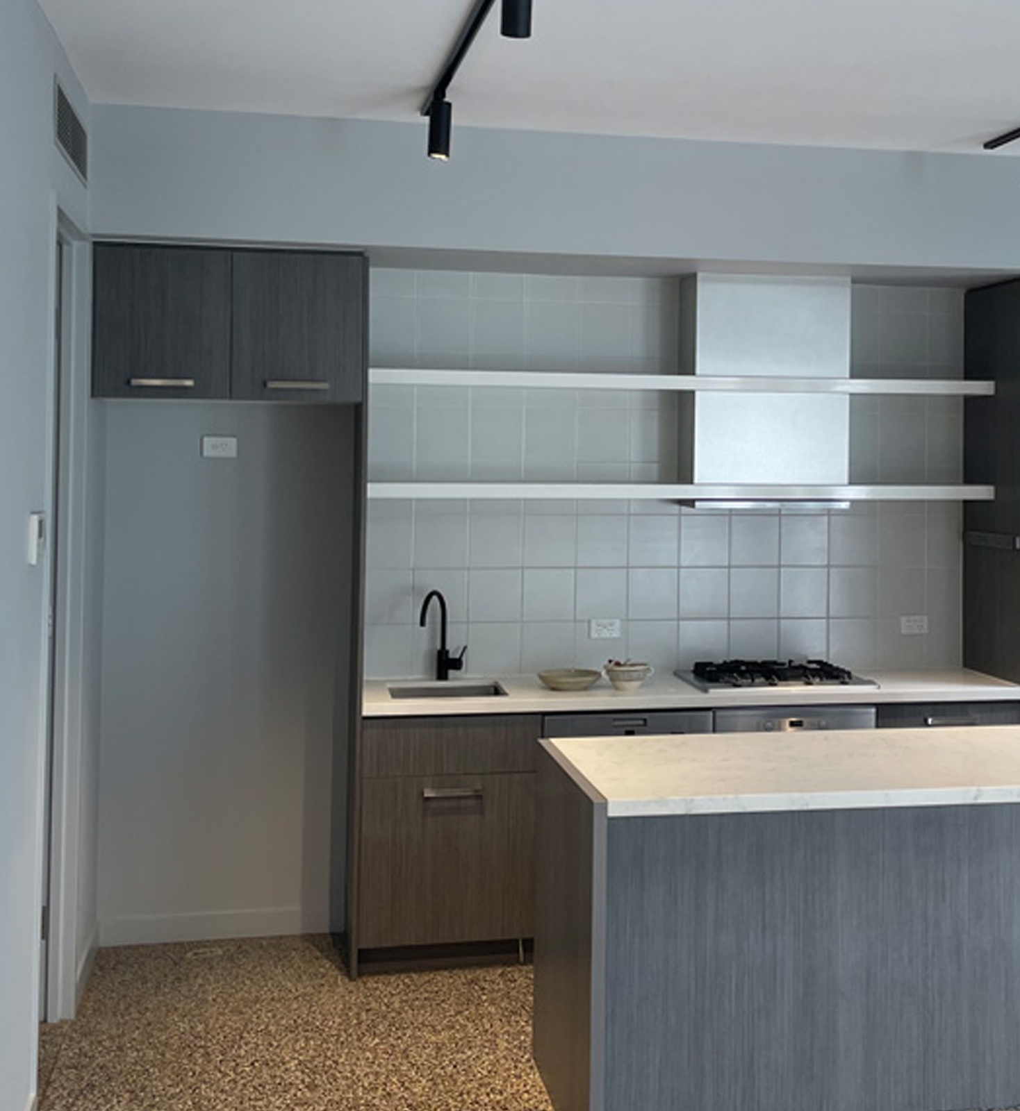 Stylish apartment kitchen with island counter