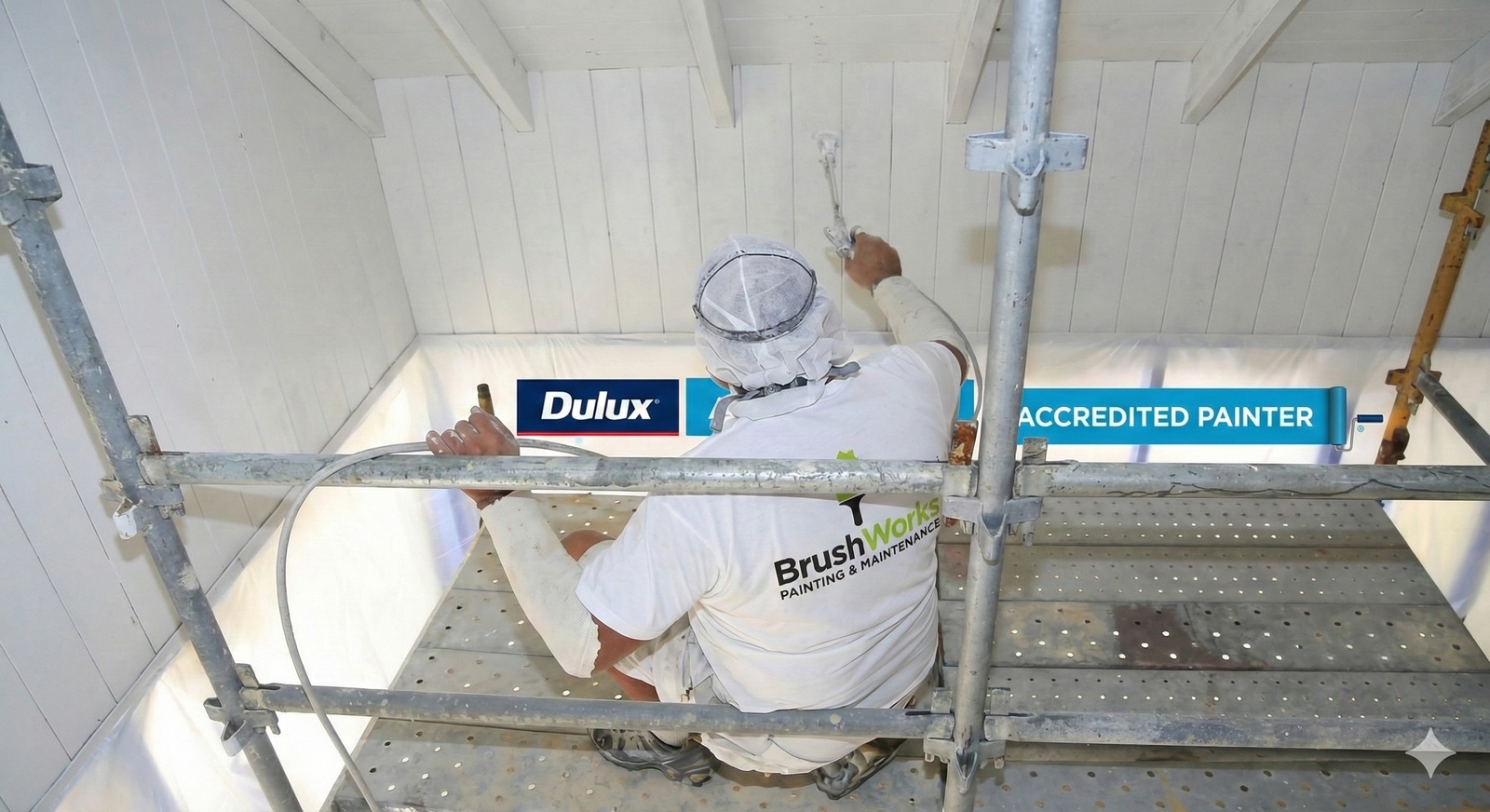 Painter on scaffolding in Woolloomooloo Sydney